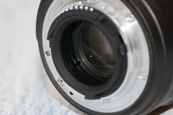 Close-up, macro, back part of camera lens, side view. Concept of camera, service center. There is a place for text. — Stock Photo, Image