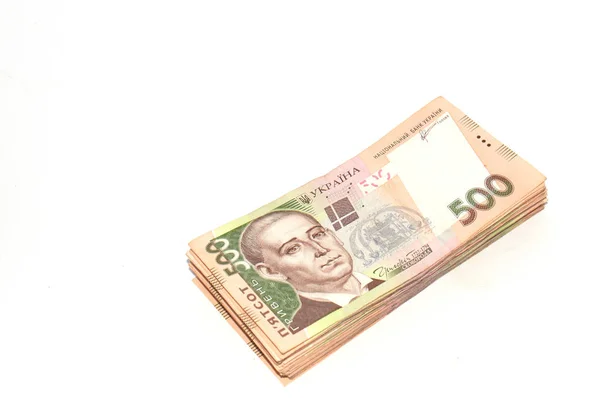 Uma pilha de dinheiro ucraniano para quinhentos hryvnia isolado em um fundo branco. Vista superior, espaço de cópia . — Fotografia de Stock