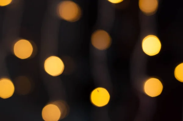 Egy koszorú sárga fényei. Karácsony, Szilveszter háttér. — Stock Fotó