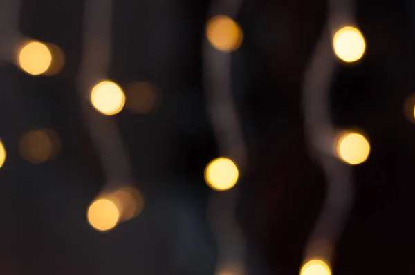 A koszorú sárga fényei. Karácsony, Szilveszter háttér. — Stock Fotó