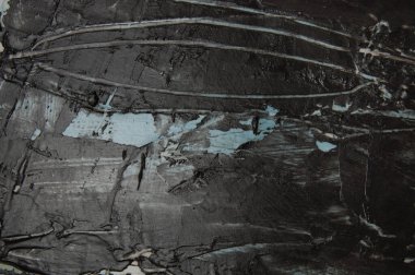 Koyu gri beton ya da desenli macun. Duvarda mavi lekeler ve kopya alanı var.