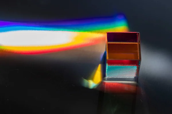 Colored square crystal on a gray surface