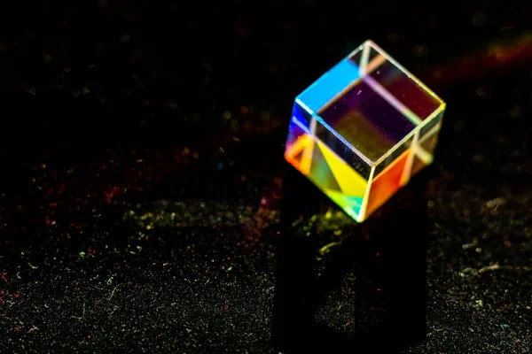 Colored square crystal on a black background