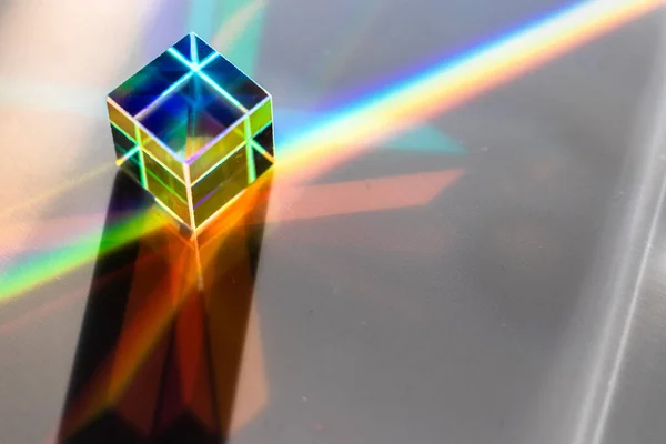 Colored square crystal on a gray surface