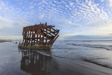 The Peter Iredale shipwreck near Astoria Oregon taken near sunset. clipart