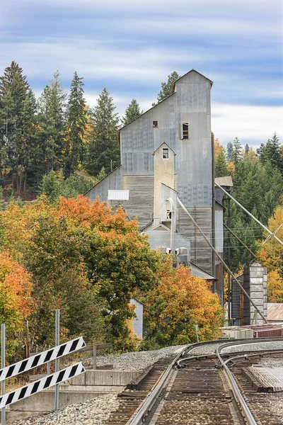 Railroad tracks lead to a vintage industrial building in Bonners Ferry, Idaho.