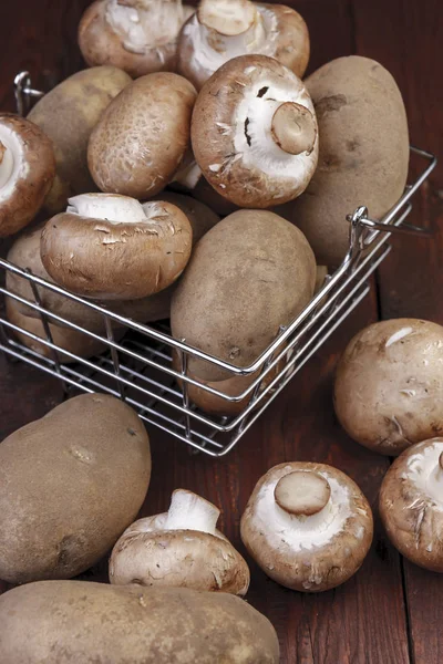 Metal Wire Basket Filled Potatoes Mushrooms Wooden Table — Stock Photo, Image
