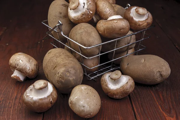 Metal Wire Basket Filled Potatoes Mushrooms Wooden Table — Stock Photo, Image
