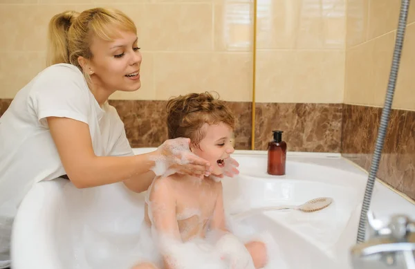 Little Boy Washing Playing Bathtub Foam Soap Bubbles His Mother — Stock Photo, Image