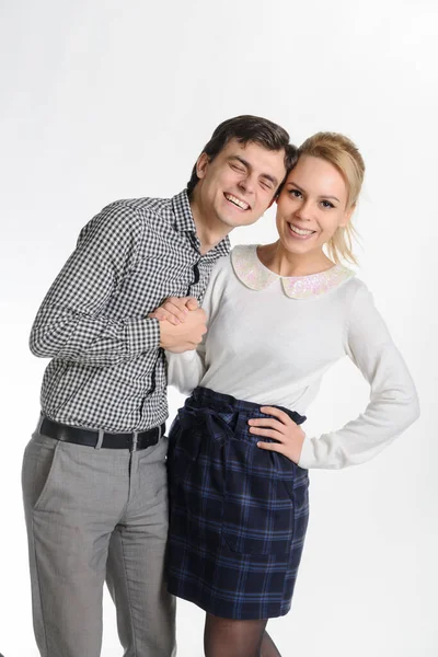 adult sister and brother in formal outfit on a white background