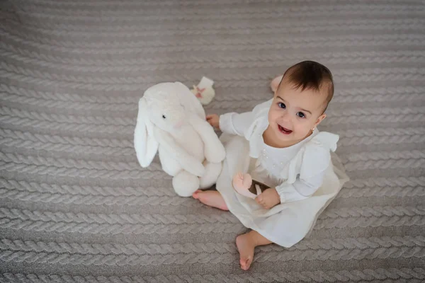 Top View Cute Baby Girl White Dress Gray Blanket Home — Stock Photo, Image