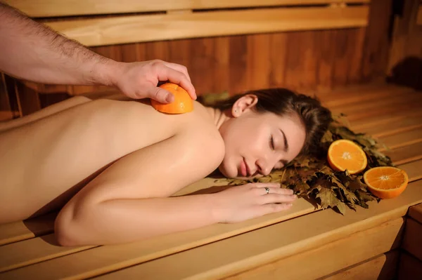 Lateral View Beautiful Woman Enjoying Massage Procedure Oranges Birch Broom — Stock Photo, Image