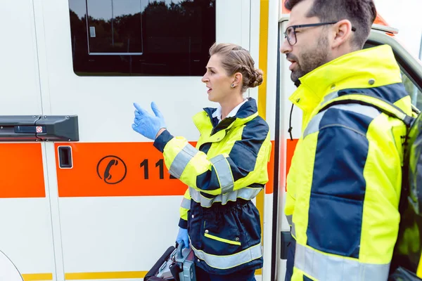 Paramedic nurse and emergency doctor at ambulance — Stock Photo, Image