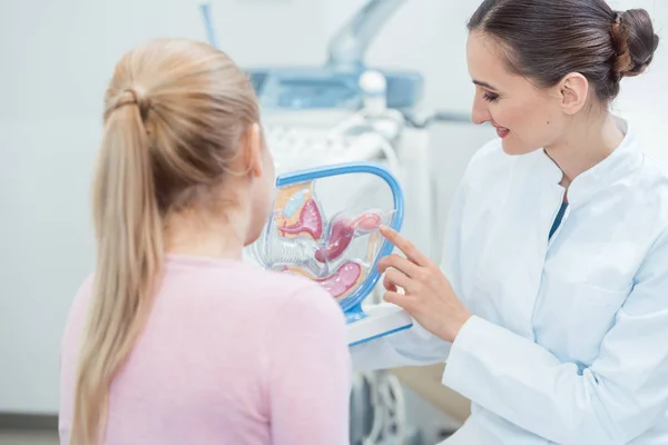 Childless woman in fertility clinic talking to doctor — Stock Photo, Image