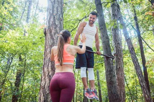 Woman Watches Man Doing Exercises High Bars Forest Gym — Stock Photo, Image