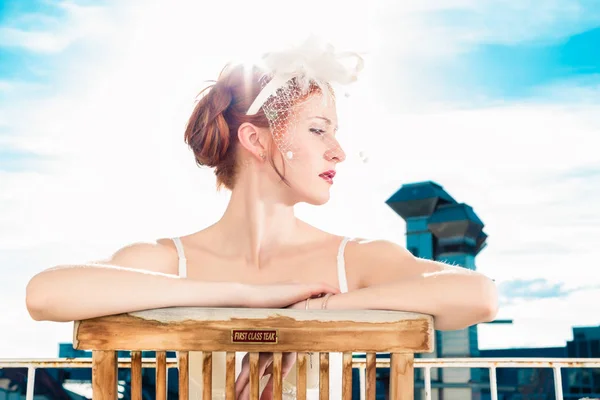 Bride with bridal lingerie sitting on balcony — Stock Photo, Image