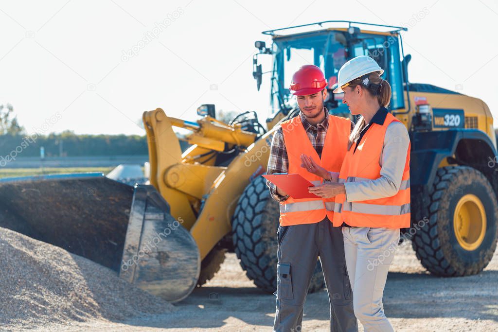 Man and woman worker on construction site