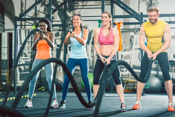 Determined and strong cheerful people during functional training — Stock Photo, Image