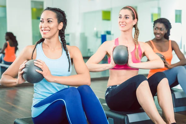 Beautiful woman exercising Russian twist with med ball for strong abs — Stock Photo, Image