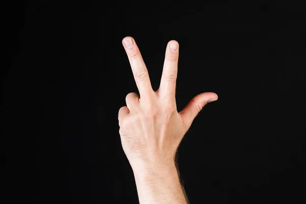Mann med tre fingre. – stockfoto