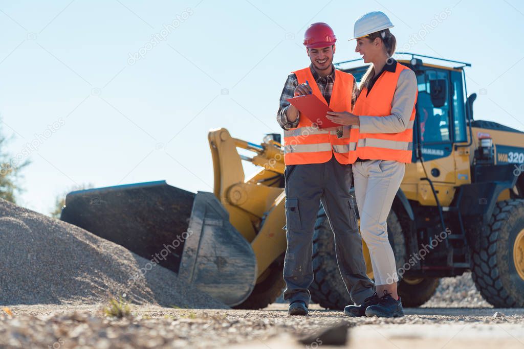 Man and woman worker on construction site