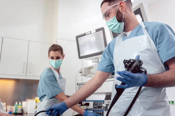Team of doctors performing endoscopy in hospital — Stock Photo, Image