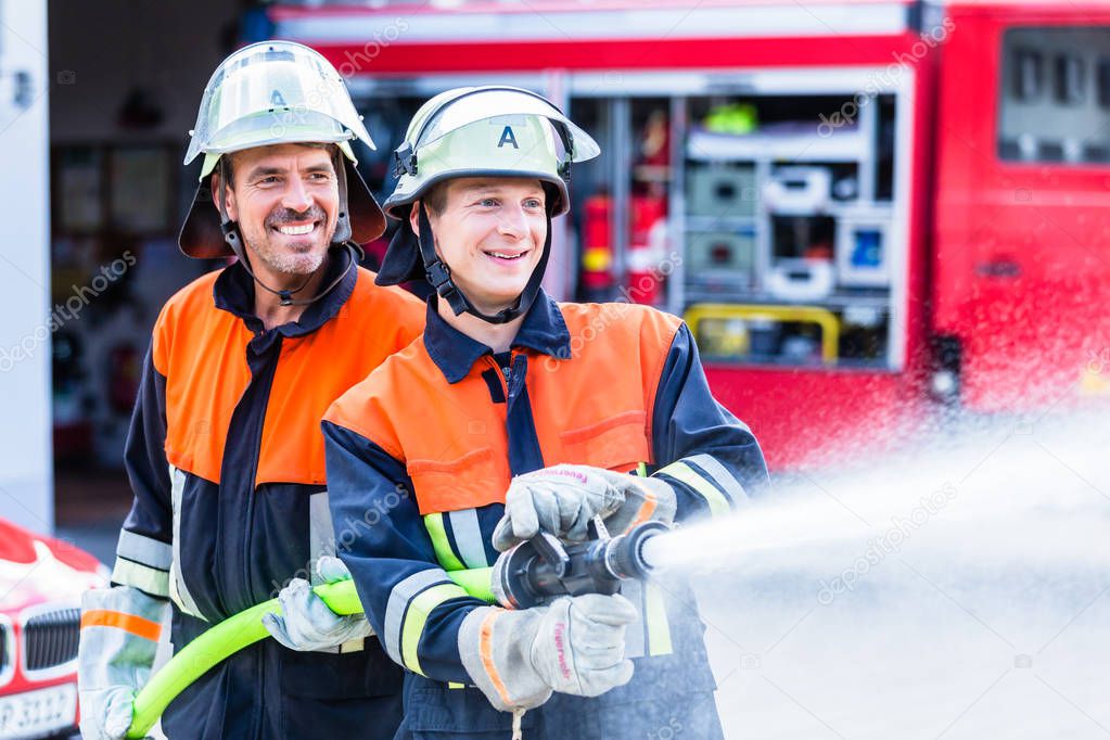 Men of the fire department extinguish fire