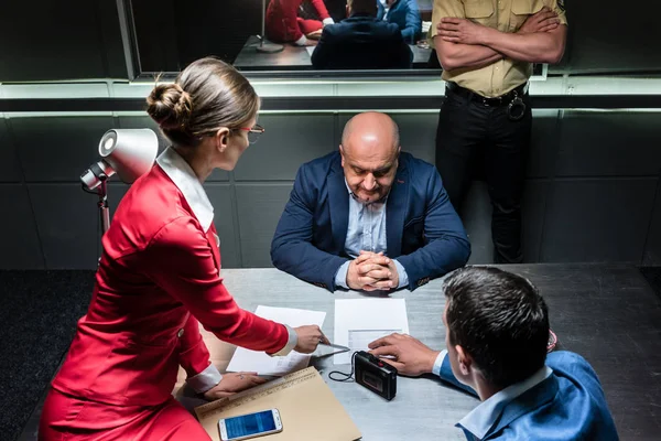 Middle-aged man thinking about his statement and the criminal charge — Stock Photo, Image