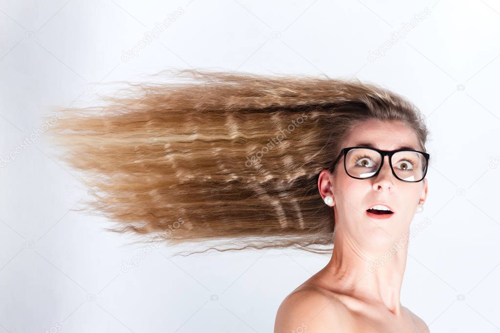 Long hair of woman blown by the wind