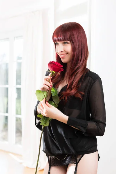 Side view of woman with rose — Stock Photo, Image