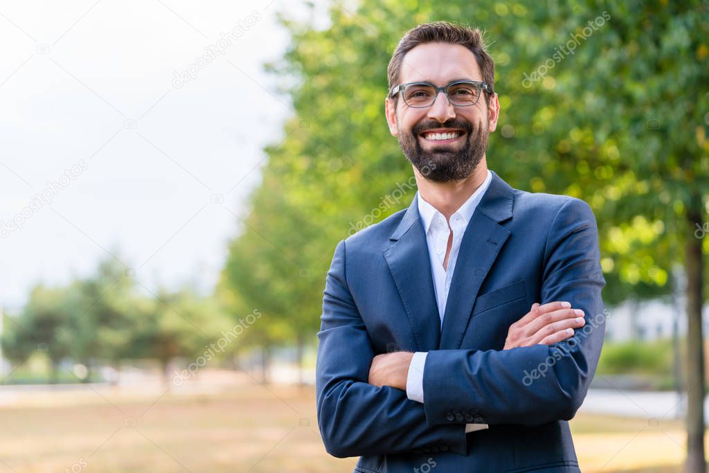 Portrait of confident businessman with crossed arms