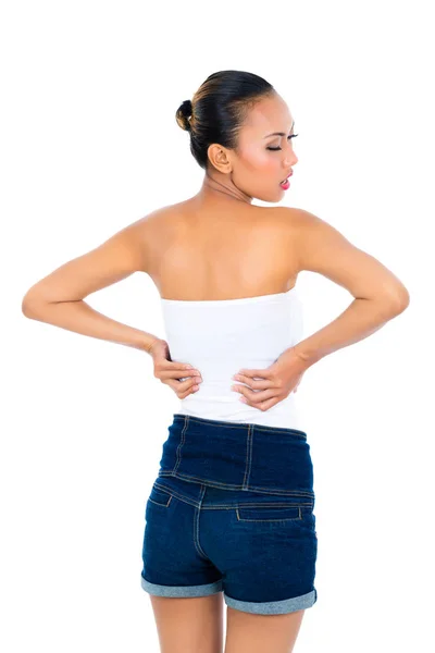 Young woman suffering from back pain — Stock Photo, Image