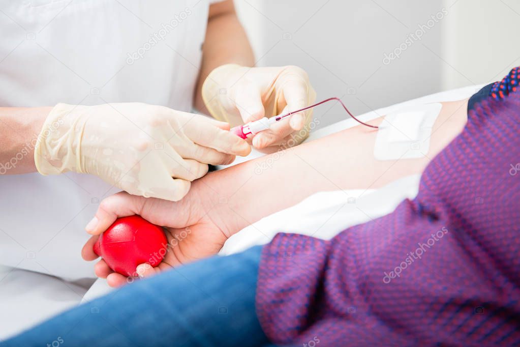 Doctors assistant setting vein access