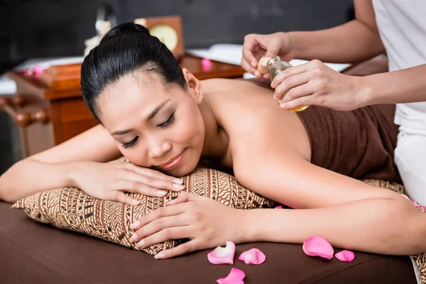 Woman receiving back massage