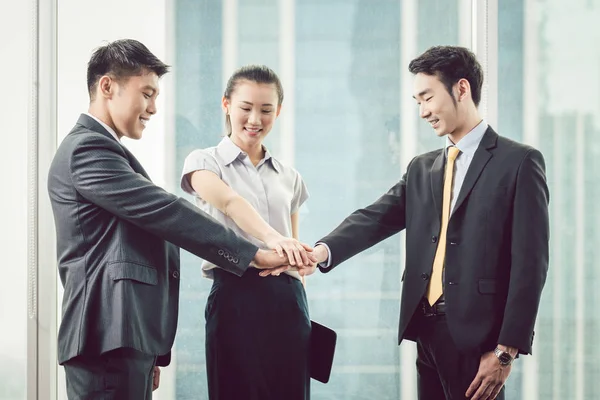 Businesspeople stacking each others hand — Stock Photo, Image