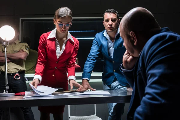 Two persuasive investigators trying to obtain a confession — Stock Photo, Image