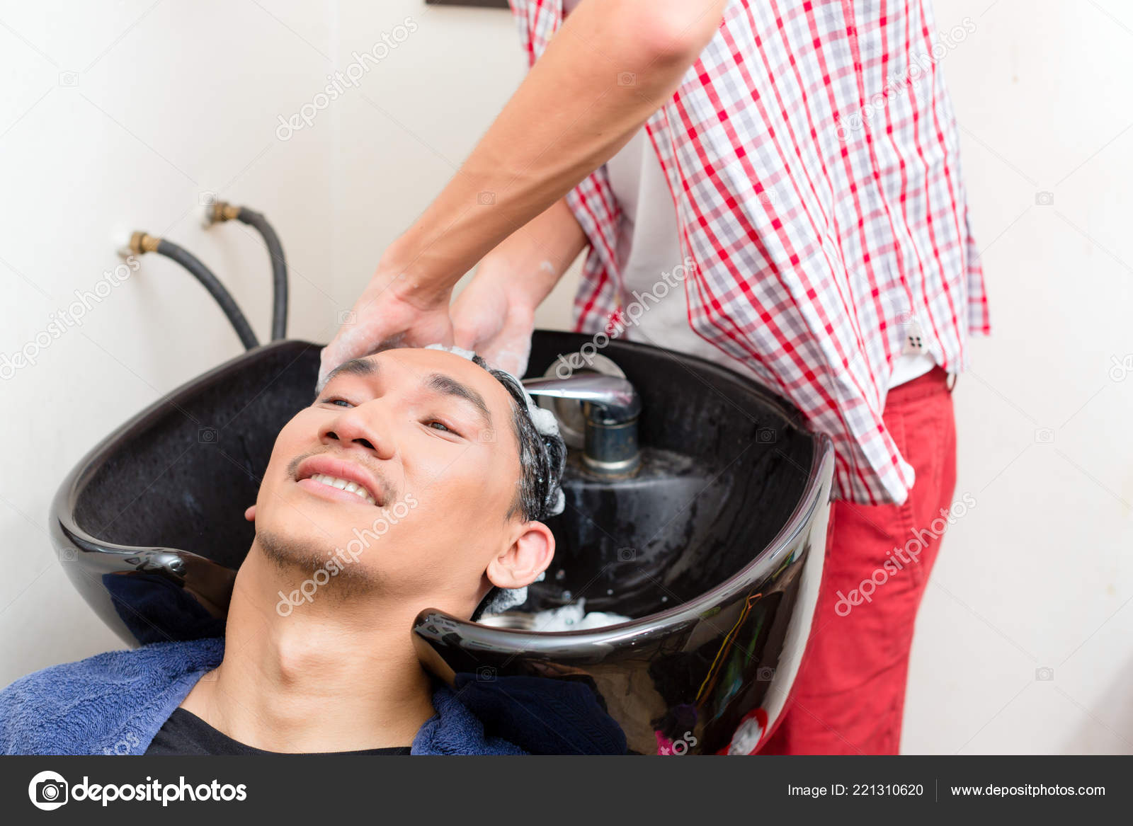 Barber Washing Hair In Sink Stock Photo C Kzenon 221310620