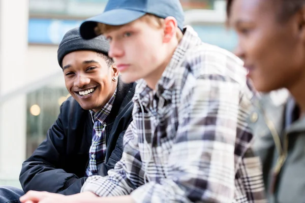 Caucasian boy with her african friends — Stock Photo, Image