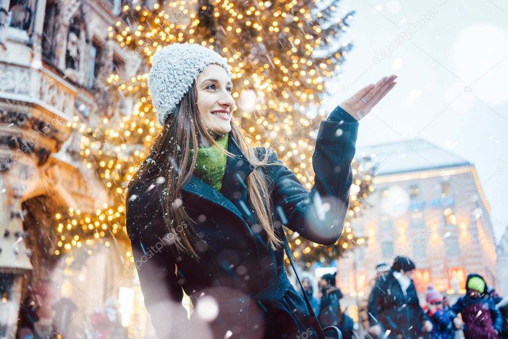 Woman enjoying Christmas time in the city