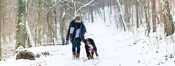 Woman with her dog hiking or walking in winter — Stock Photo, Image