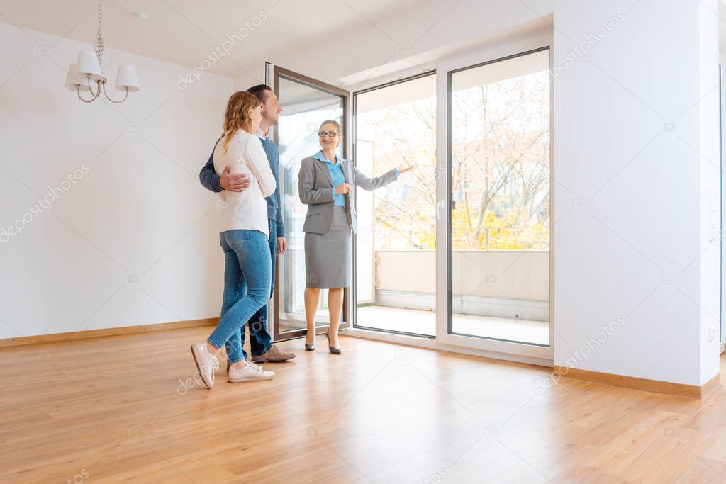 Young couple getting tour through apartment they consider renting