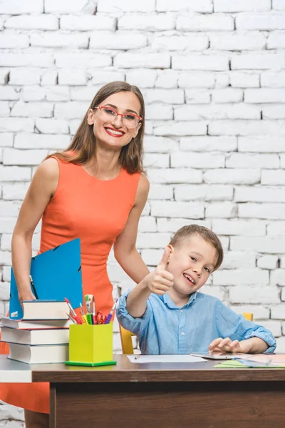 Teacher and school student looking at the camera — Stock Photo, Image