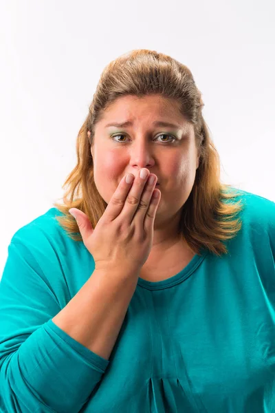 Worried woman with her hand over mouth — Stock Photo, Image