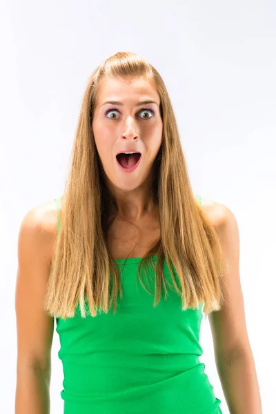 Izgatott fiatal nő, a zöld tanktop — Stock Fotó