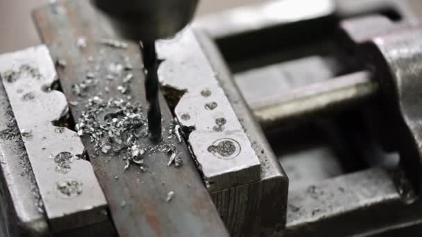 Drilling a hole into a piece of metal — Stock Video