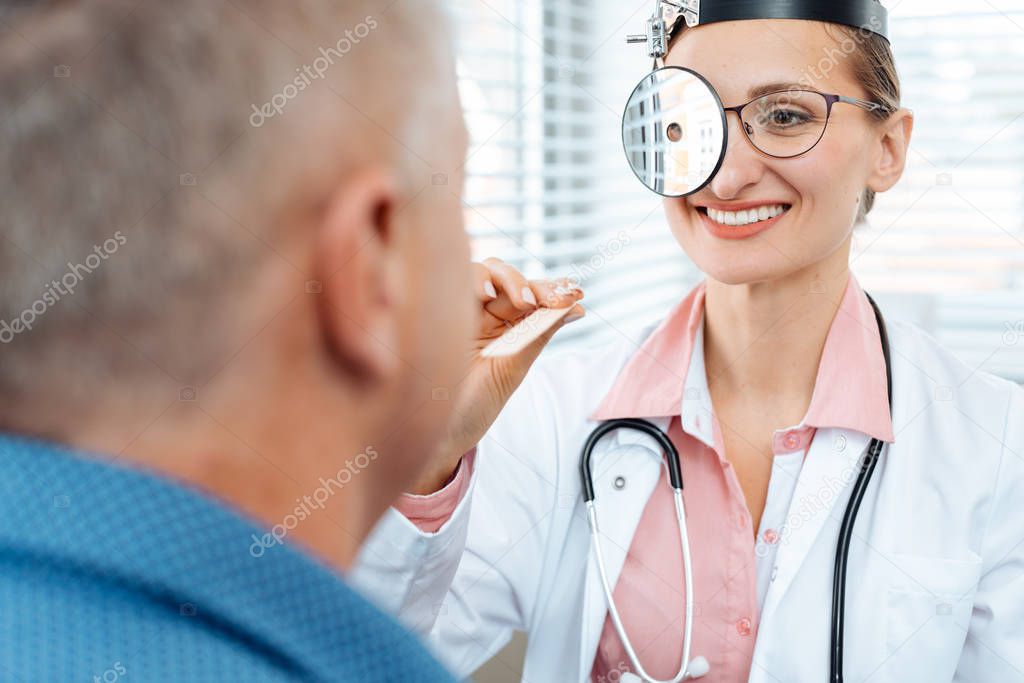 ENT doctor examining patient