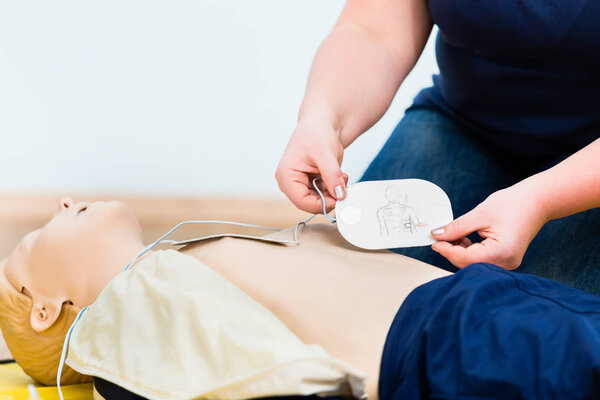 Woman in first aid course training reanimation