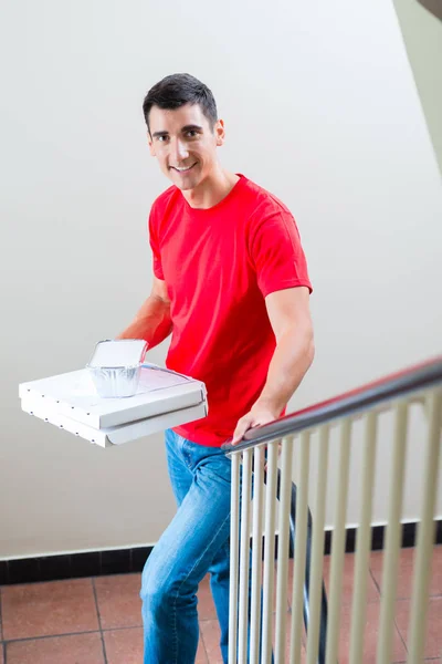 Fast food delivery man with parcel — Stock Photo, Image