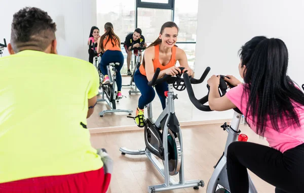 Woman exercising on bicycle — Stock Photo, Image