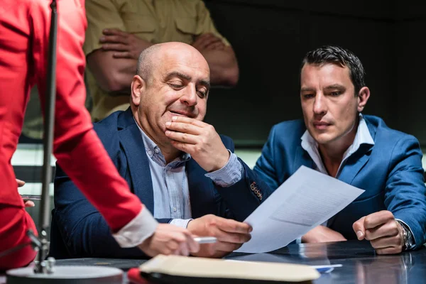 Man under the pressure of a difficult interrogation at the police — Stock Photo, Image